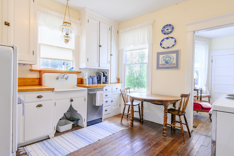 Interior of a kitchen in antique and vintage style with blue theme. Real estate photography service by kiss of Heaven Photography.
