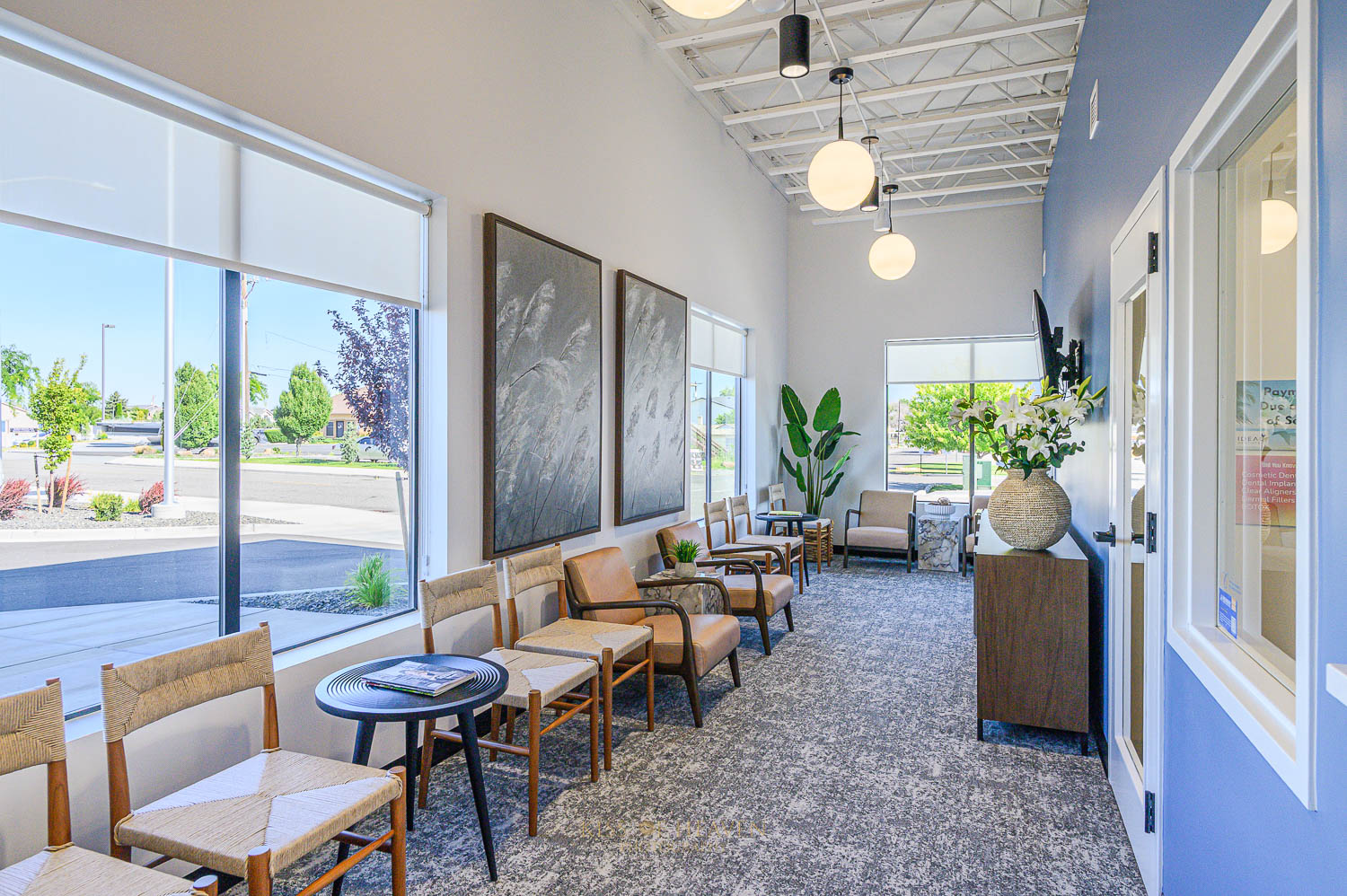 A reception area showing outside window in a modern dental clinic in Richland, WA. Commercial photographer by Kiss of Heaven Photography.