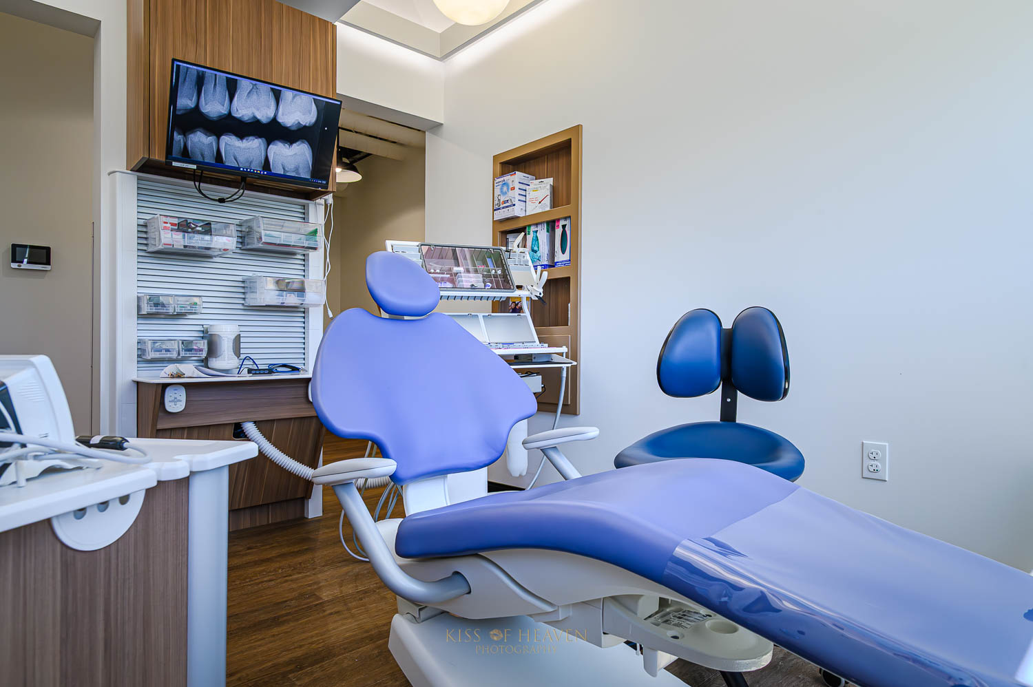 A dental room with blue dental chair designed Ergonomic in a clinic in Richland, WA. Commercial photographer by Kiss of Heaven Photography.
