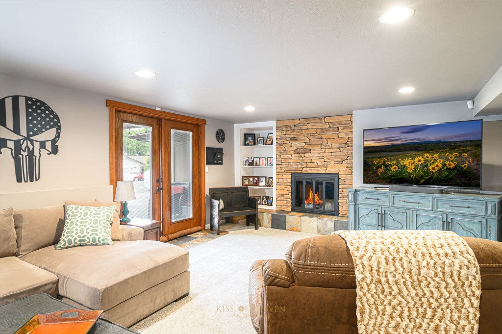 Living room with fireplace in a home in Yakima, WA.  Real estate photography by Kiss of Heaven Photography.