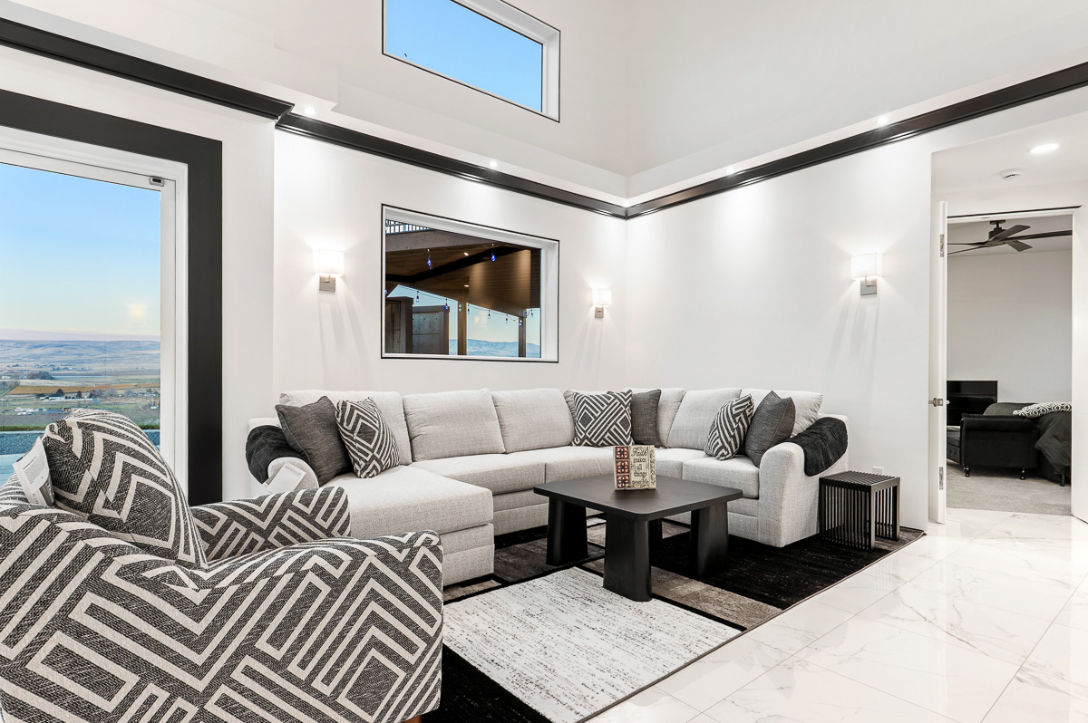 Premium shooting and edit of luxury interior showing view outside and bright edits of living room by Kiss of Heaven Photography.