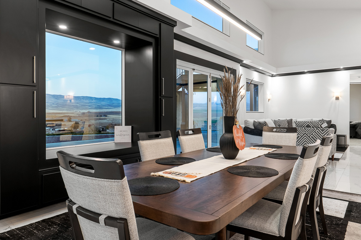 Premium shooting and edit of luxury interior showing view outside and bright edits of dining room by Kiss of Heaven Photography.