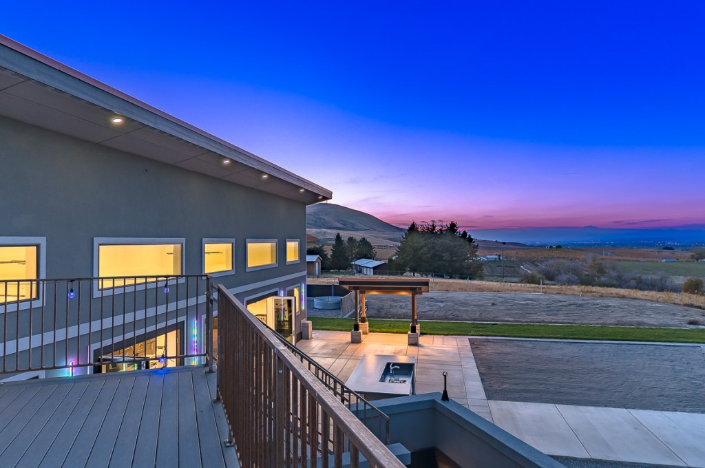 Twilight image from a balcony of a luxury home, premium edit by Kiss of Heaven Photography